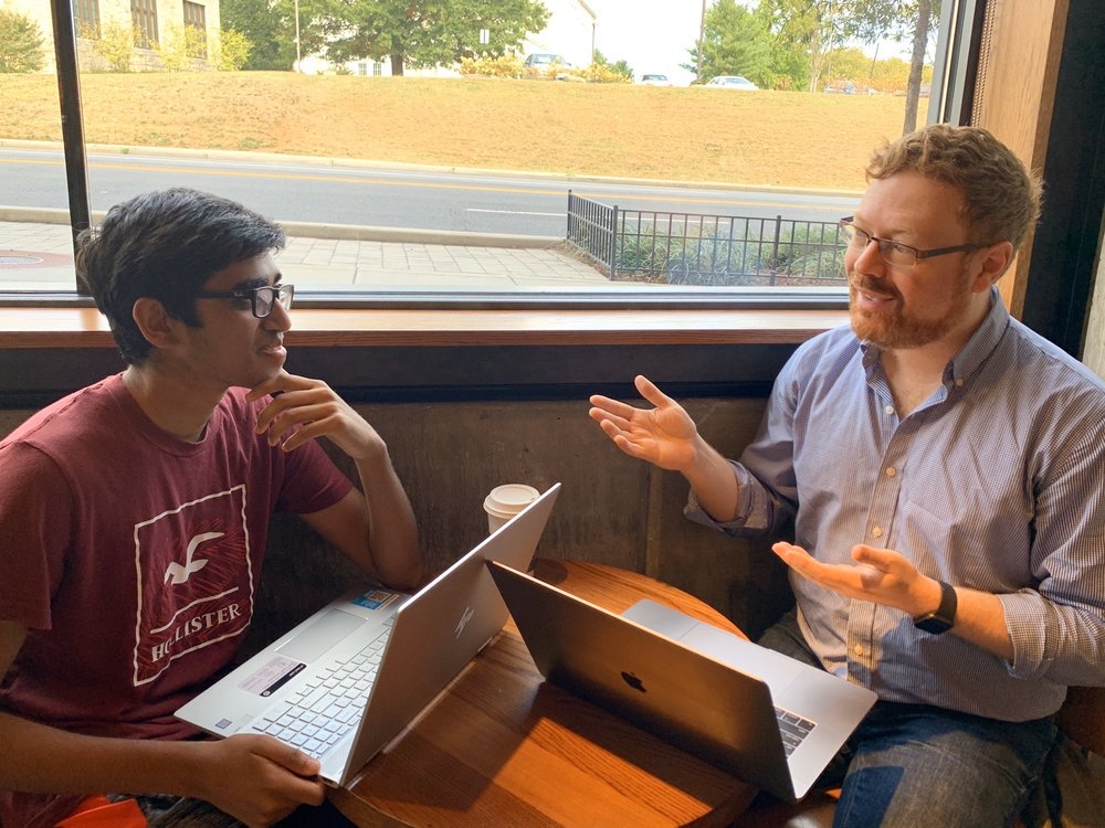 Matt Schwartz working through a college essay draft with a student